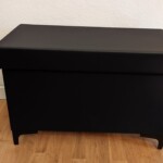 Wäschetruhe mit Lederverkleidung